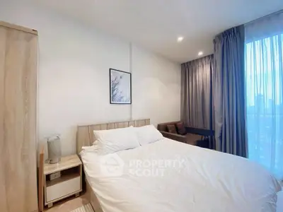 Cozy bedroom with modern decor and large window view