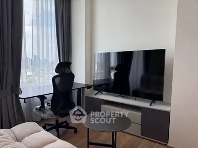 Modern living room with city view, featuring sleek furniture and large TV, perfect for urban living.