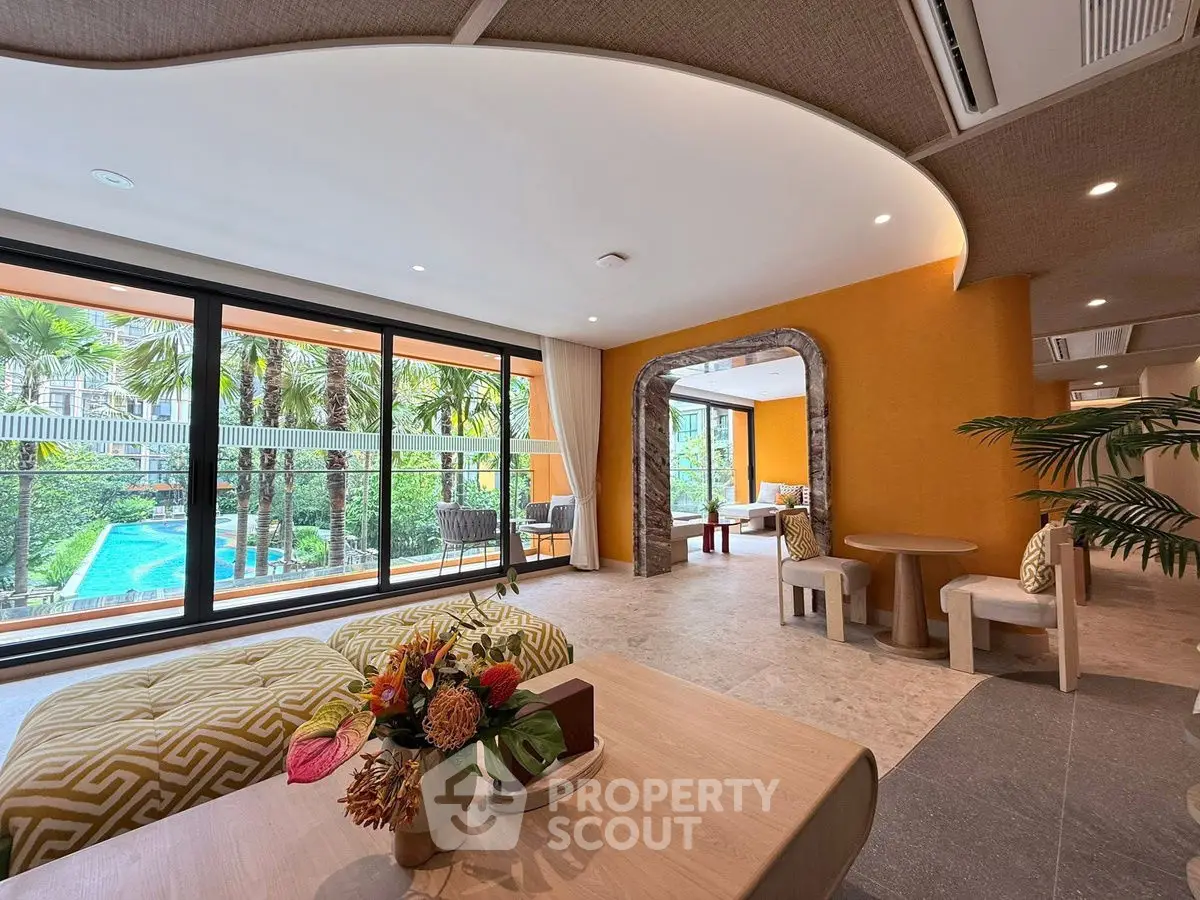 Luxurious living room with pool view and elegant decor