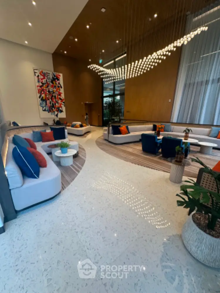 Luxurious modern living room with elegant seating and artistic decor