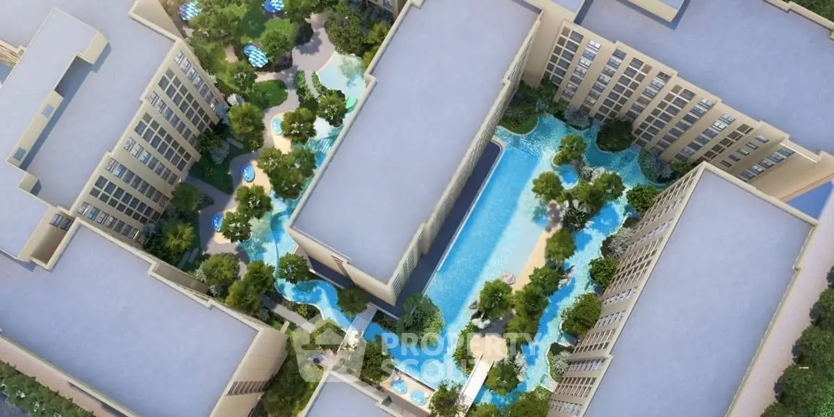 Aerial view of modern residential complex with lush gardens and swimming pools.