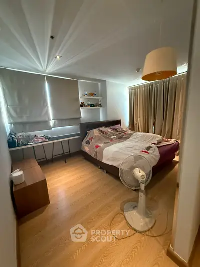 Cozy bedroom with modern decor and natural light