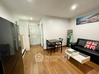Modern living room with sleek furniture and wooden flooring, perfect for urban living.