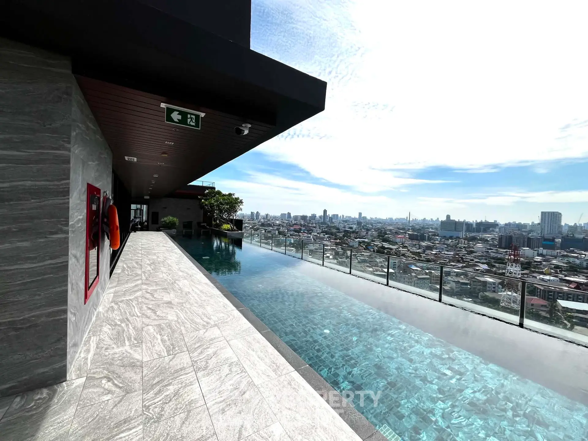 Luxurious rooftop infinity pool with stunning city skyline view
