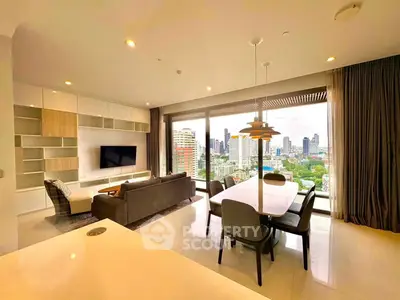 Luxurious living room with stunning city view, modern furniture, and open layout in high-rise apartment.