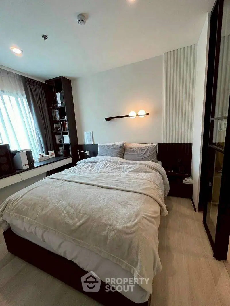 Cozy modern bedroom with natural light and stylish decor