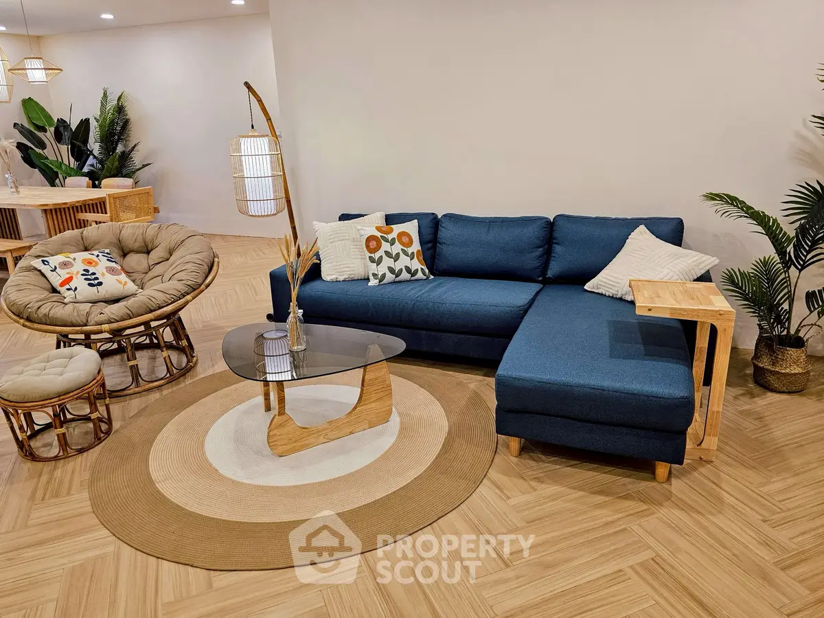 Stylish living room with modern blue sectional sofa and chic decor