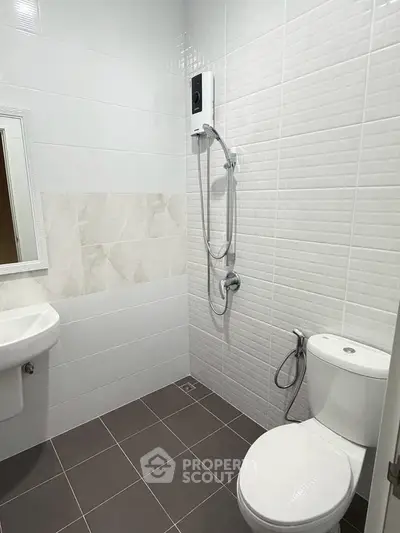 Modern bathroom with sleek white tiles and contemporary fixtures
