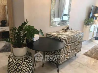 Stylish living room with modern decor, geometric patterns, and indoor plants enhancing the ambiance.