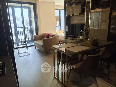 Modern open-plan living room with city view and stylish furniture