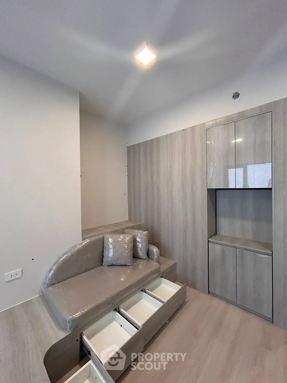 Modern living room with built-in storage and sleek design