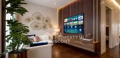 Modern living room with stylish decor and large wall-mounted TV, featuring elegant wood paneling and cozy seating.