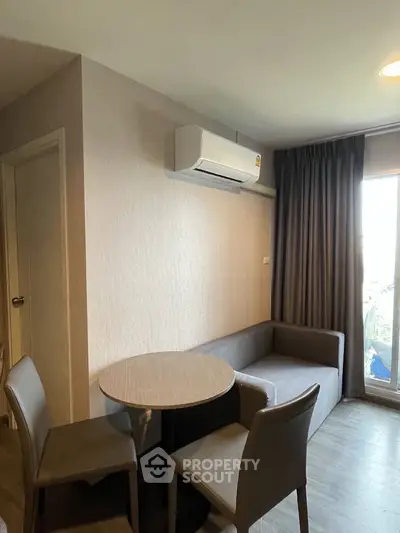 Cozy living room with modern furniture and air conditioning in a stylish apartment.