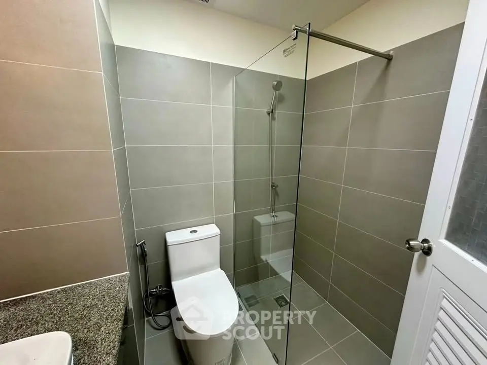 Modern bathroom with sleek glass shower and contemporary fixtures