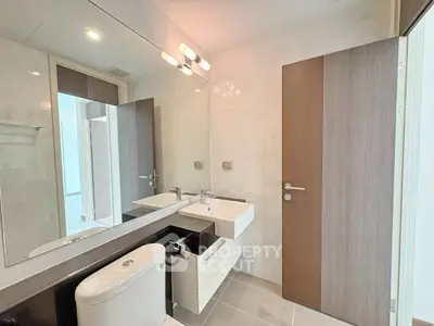 Modern bathroom with sleek fixtures and elegant design in a contemporary apartment.