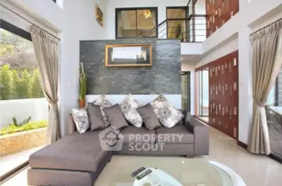 Luxurious modern living room with large windows and stylish decor