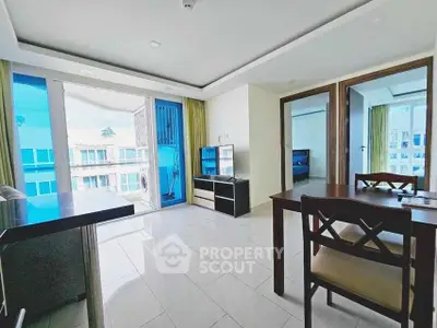 Bright modern living space with large windows and stylish furniture