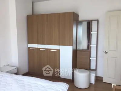 Spacious bedroom with modern wardrobe and stylish decor