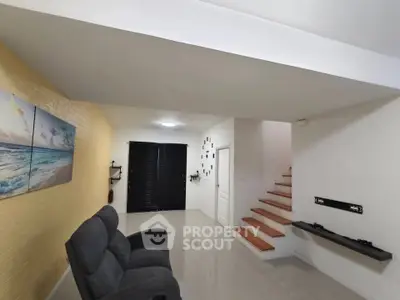 Modern living room with sleek design and cozy seating area