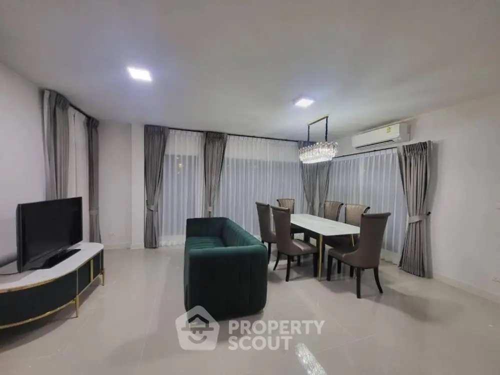 Spacious modern living room with elegant dining area and stylish furniture