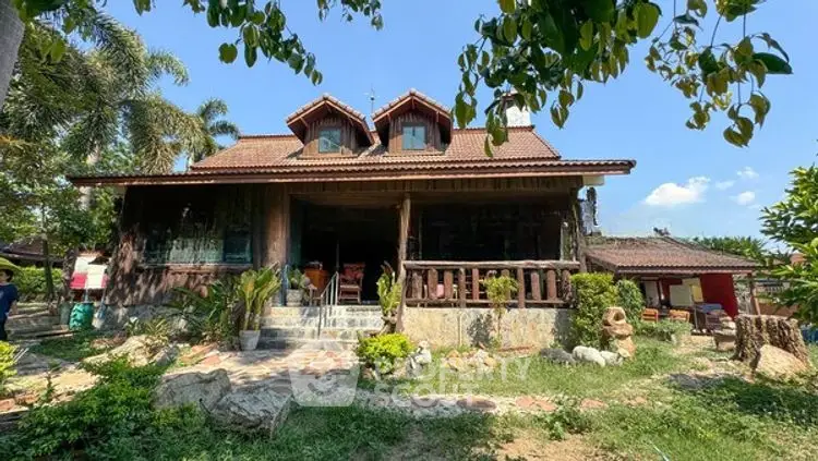 Charming rustic house with lush garden and inviting porch