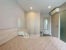 Modern bedroom with sleek design and ample storage space