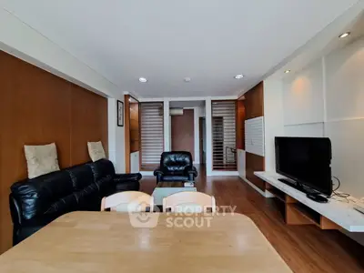 Spacious living room with modern furniture and wooden accents