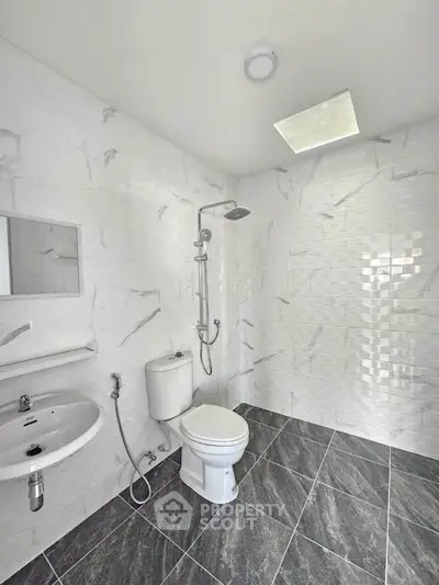 Modern bathroom with sleek fixtures and marble tiles