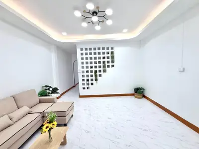 Modern living room with stylish lighting and elegant decor