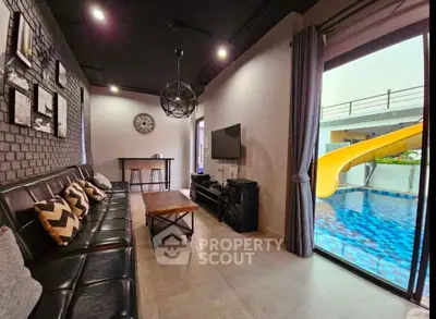Stylish living room with pool view and modern decor