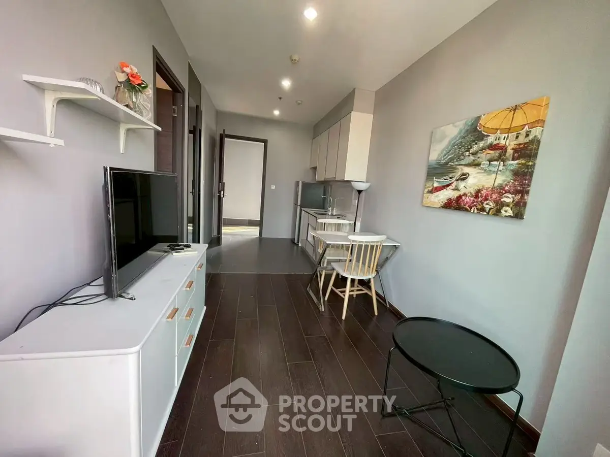 Modern living room with sleek furniture and stylish decor in a contemporary apartment.
