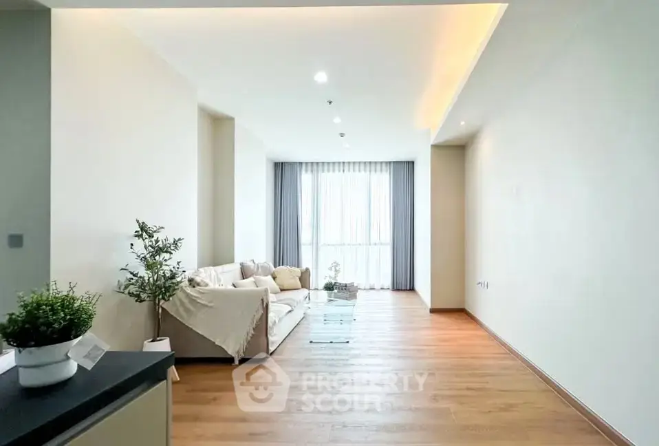 Spacious modern living room with natural light and elegant decor