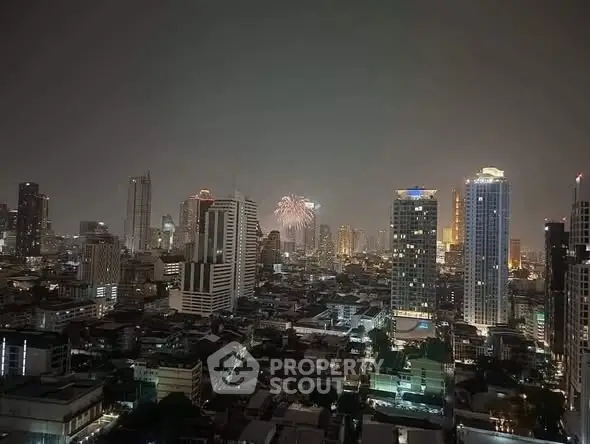 Stunning city skyline view with fireworks illuminating the night sky, showcasing urban living at its finest.