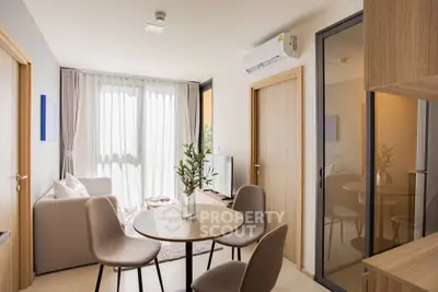 Modern living room with dining area and natural light in stylish apartment