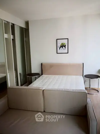 Modern bedroom with stylish decor and comfortable bed in a cozy apartment.