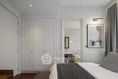 Elegant bedroom with ensuite bathroom and modern decor