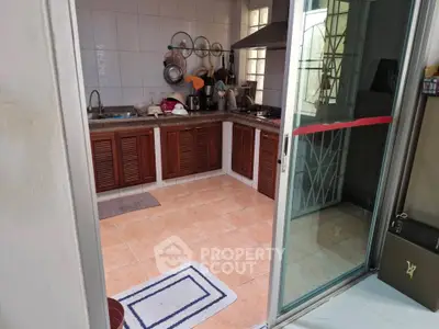 Charming kitchen with open layout and modern appliances, perfect for culinary enthusiasts.
