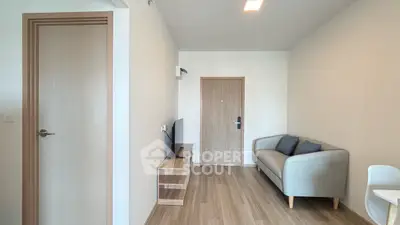 Modern living room with sleek furniture and wooden flooring