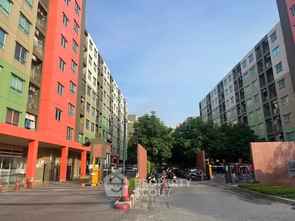 Modern apartment complex with colorful facades and spacious entrance