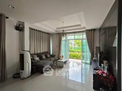 Spacious living room with modern decor and garden view