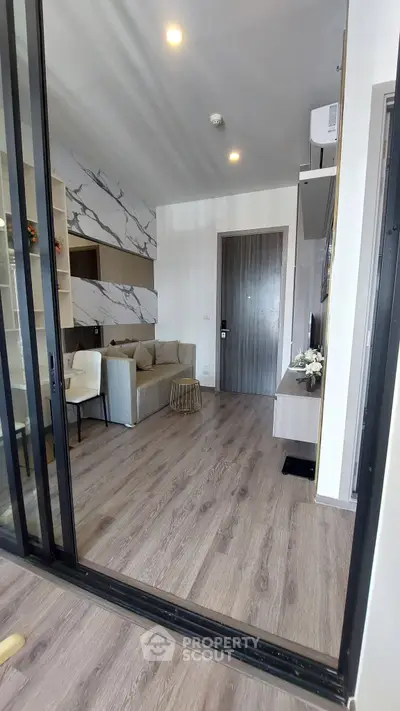 Modern living room with stylish decor and wooden flooring