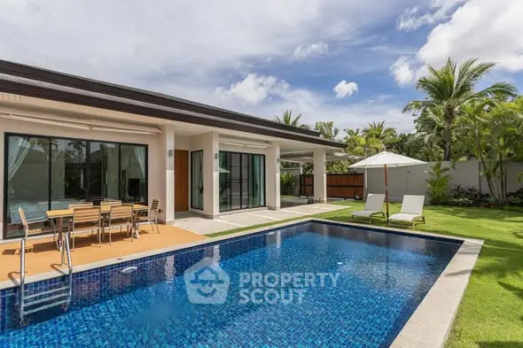 Luxurious villa with private pool and lush garden, perfect for tropical living.