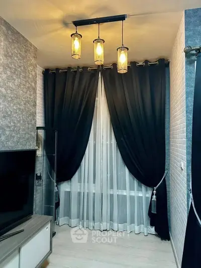 Elegant living room corner with modern lighting and dark curtains