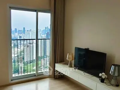 Modern living room with city view, featuring sleek TV setup and large window.