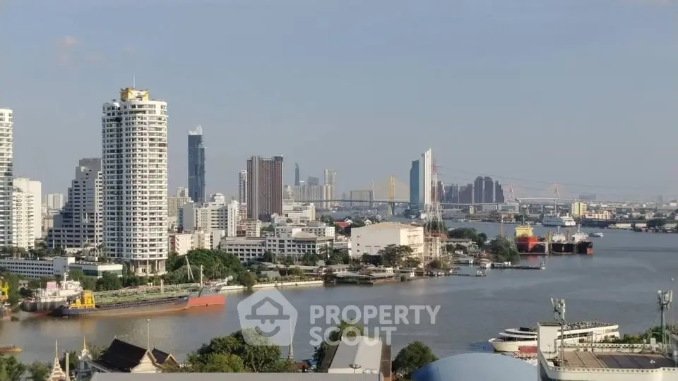 Stunning riverfront cityscape with modern high-rise buildings and serene water views.