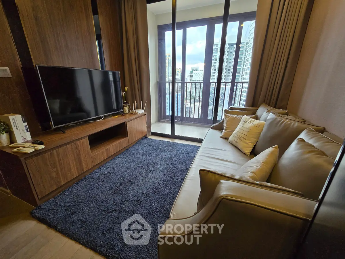 Modern living room with sleek furniture and city view balcony, perfect for urban living.