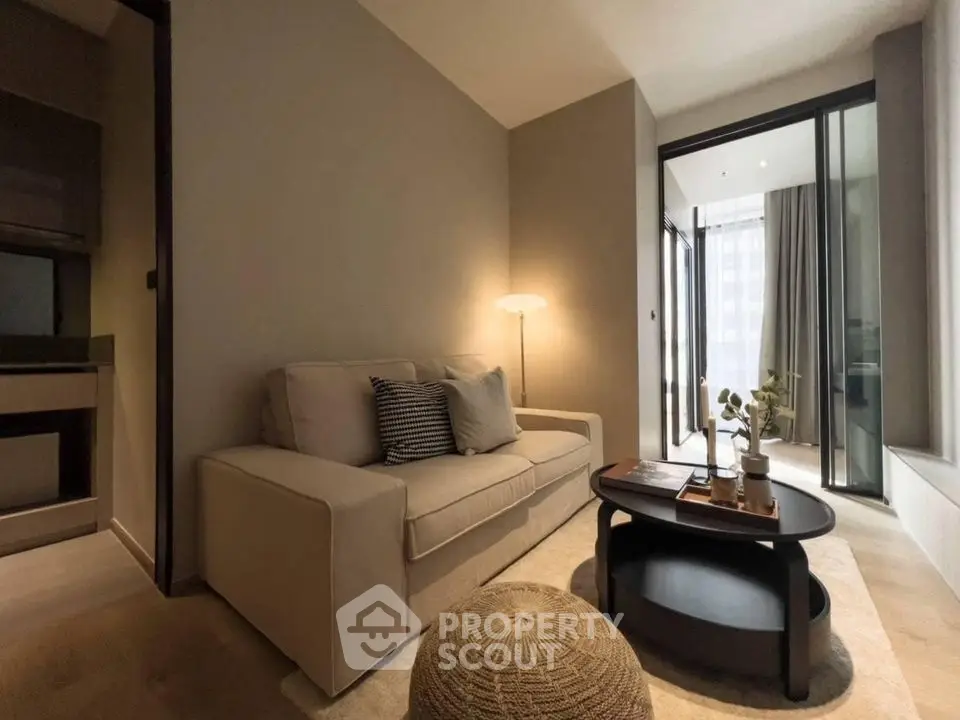 Modern living room with cozy sofa and stylish decor in a contemporary apartment.
