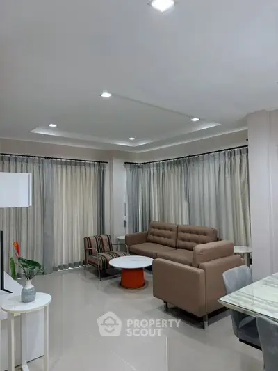 Modern living room with stylish furniture and elegant lighting