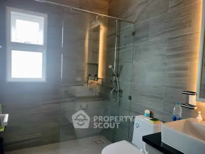 Modern bathroom with sleek design and glass shower enclosure