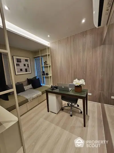 Modern study room with sleek desk and cozy seating area, perfect for productivity and relaxation.